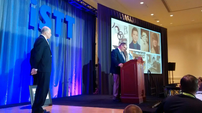 Person of the Year Bernie Trenchless Technology publisher Bernie Krzys looks on as jIm Rankin accepts his award.