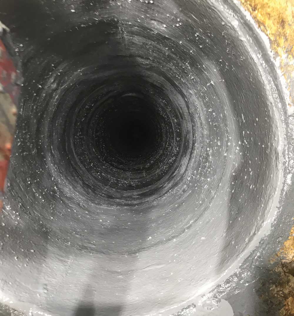 Low pressure iron pipe rehabilitation with GFRP