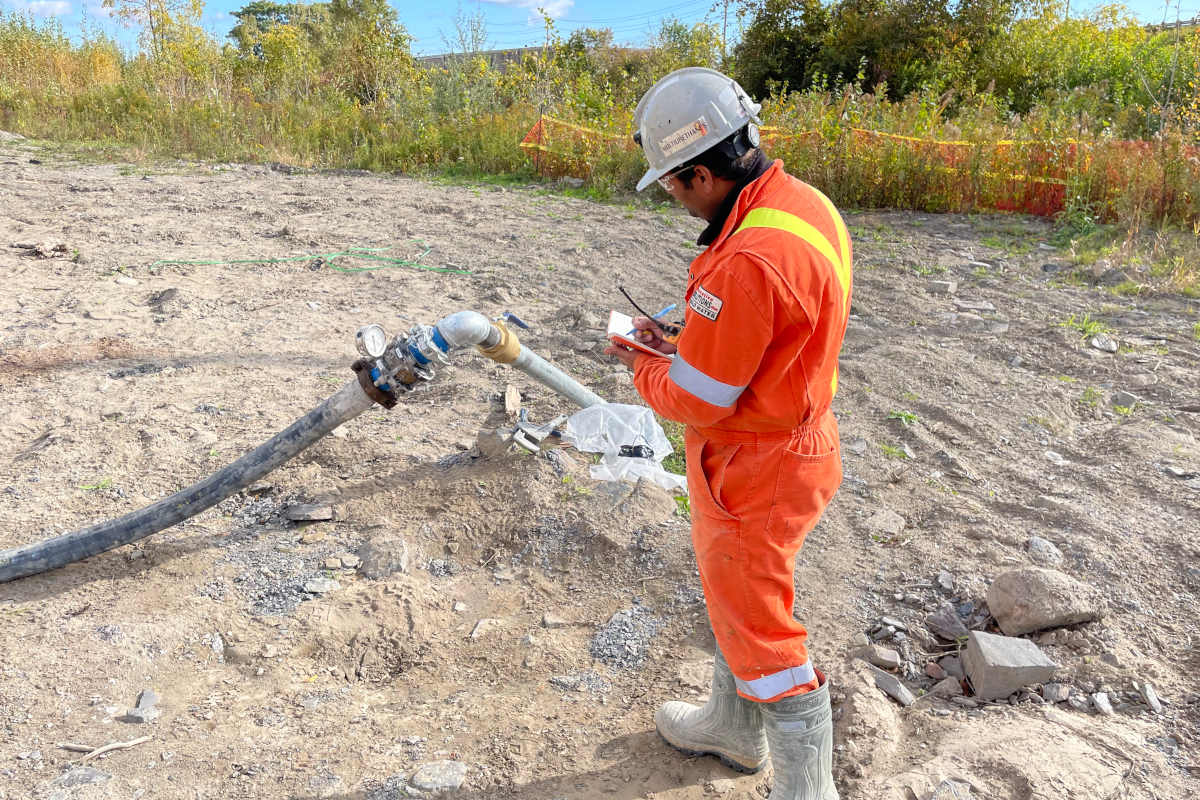 Nav Stevens,  P.Eng., project manager, diligently monitors the pumping pressure to guarantee the safety and integrity of the installed infrastructure. 